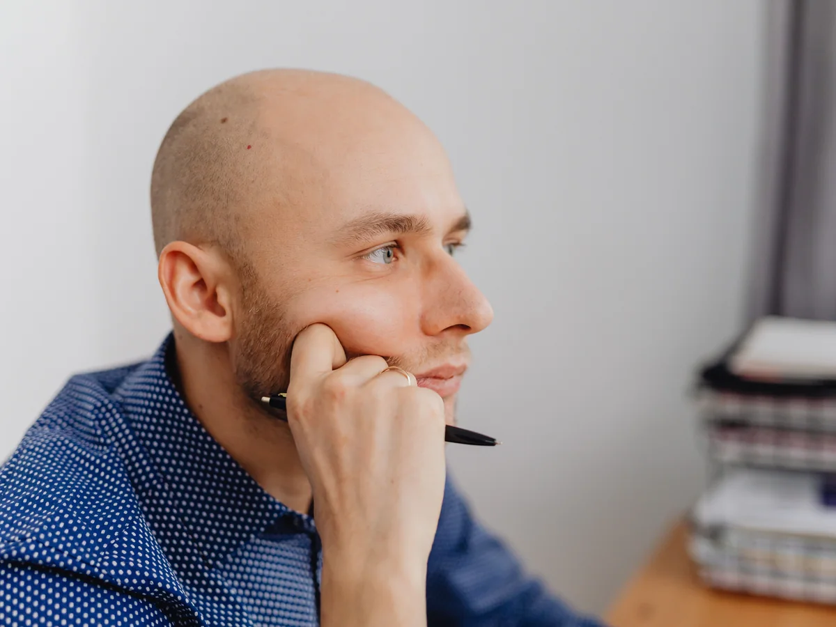 Publisher reviewing questions and contract details at a desk