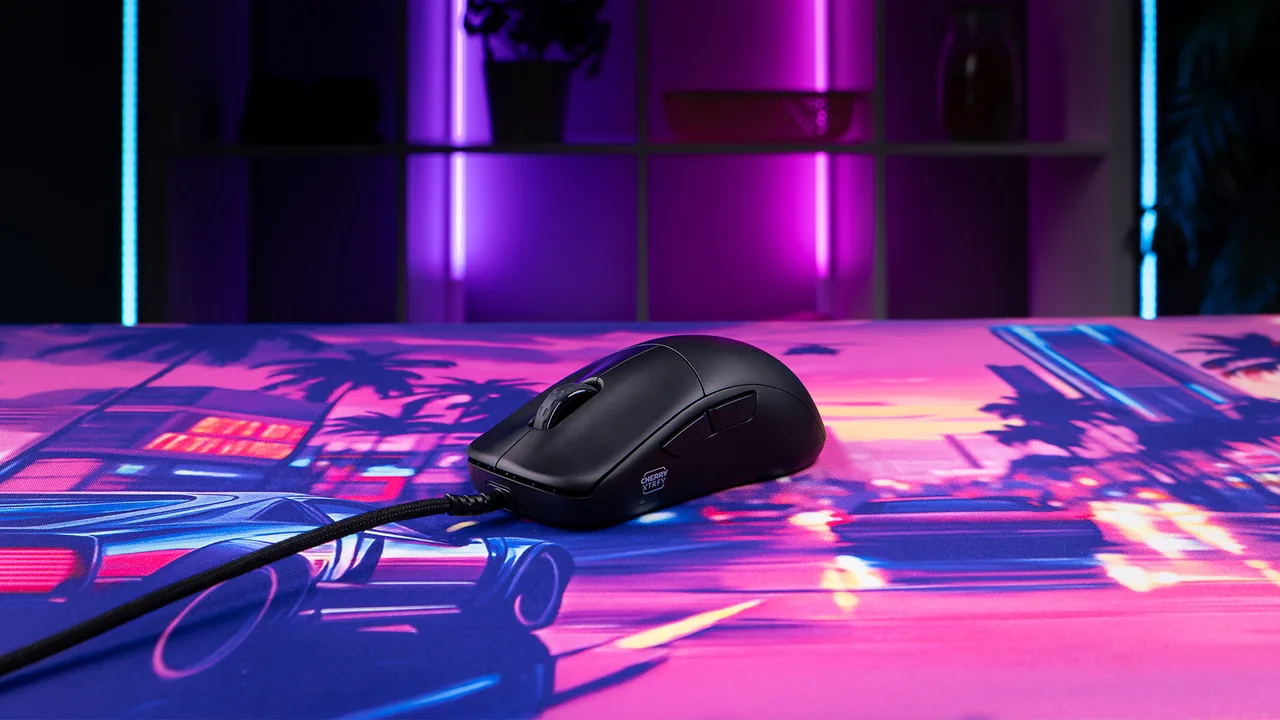 Actual CHERRY XTRFY M42V2 resting on a colorful gaming mouse pad