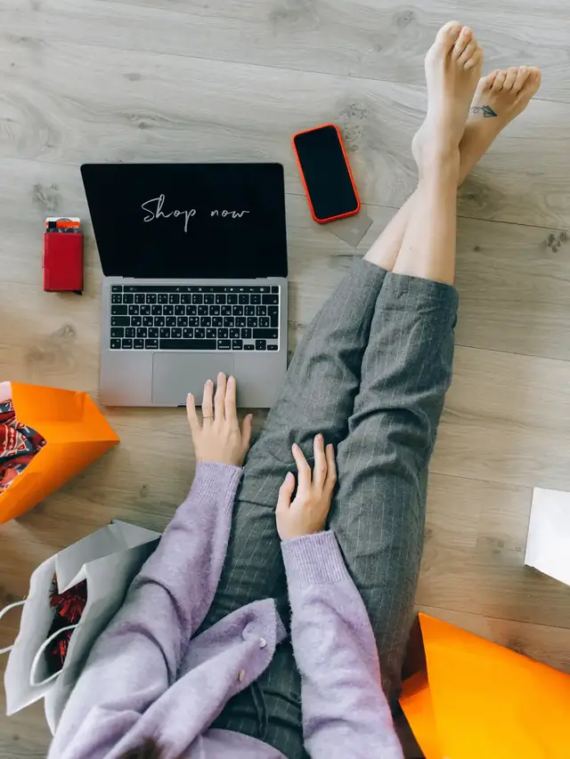 Person researching a product claim on a thin laptop from above