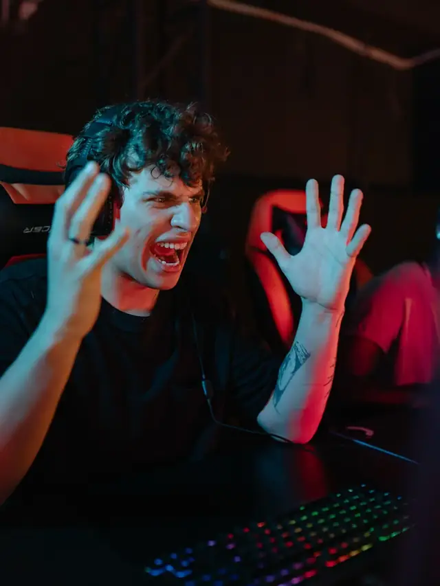 The recurring curly-haired gamer reacting during play; posed stock illustration, not evidence of an actual missed shot