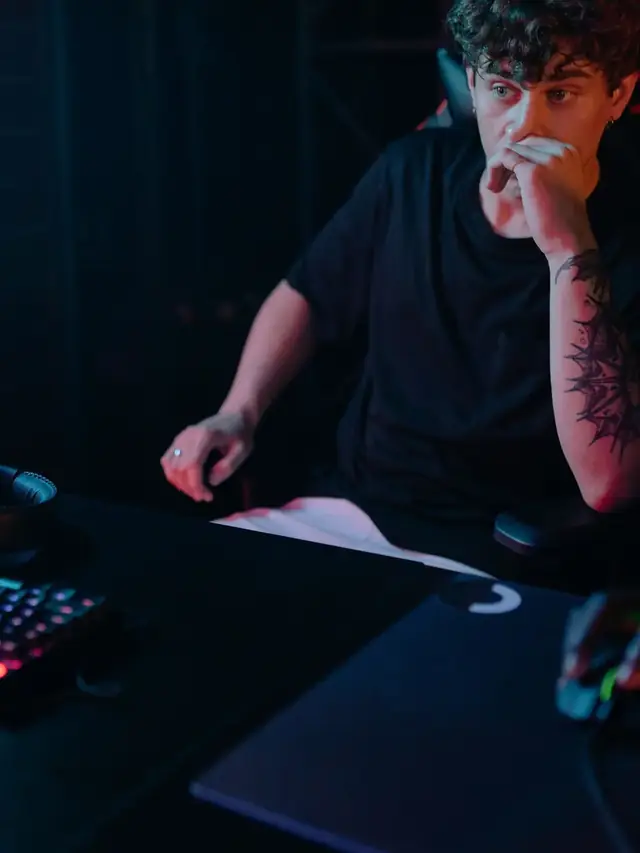 The same curly-haired gamer considering his computer screen; stock illustration of reviewing comparison conditions