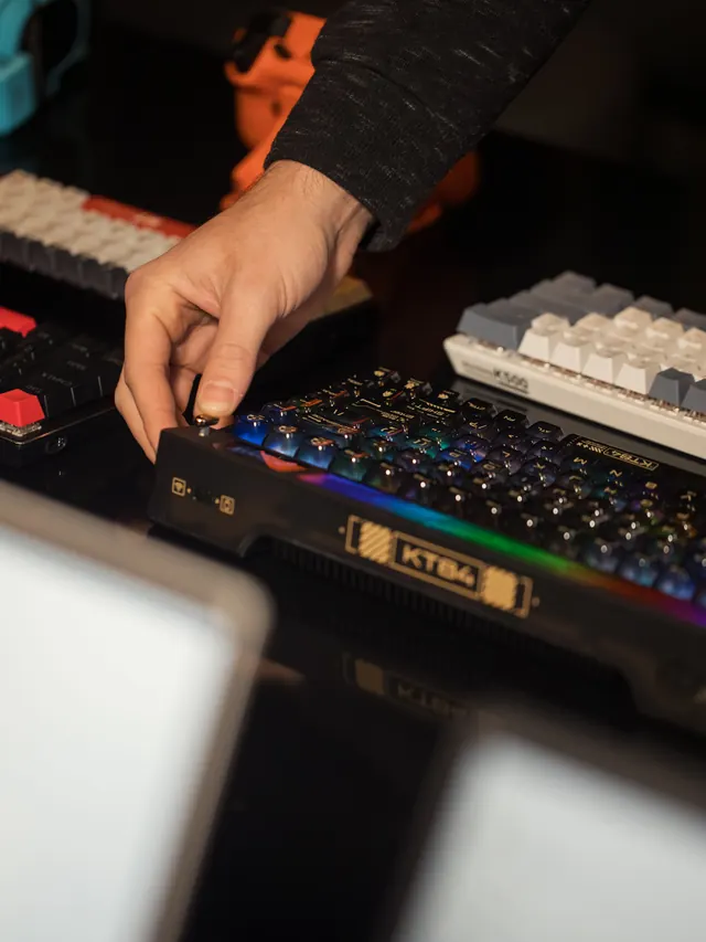Hand adjusting a mechanical gaming keyboard on a display table