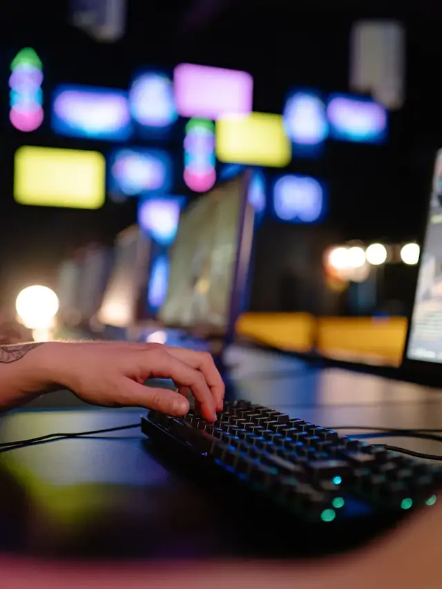 A hand reaching across a generic gaming keyboard; stock illustration of checking which actions are comfortable together