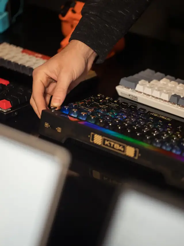 Hands adjusting a generic mechanical keyboard on a desk; stock illustration of checking hardware, not a Wooting disassembly