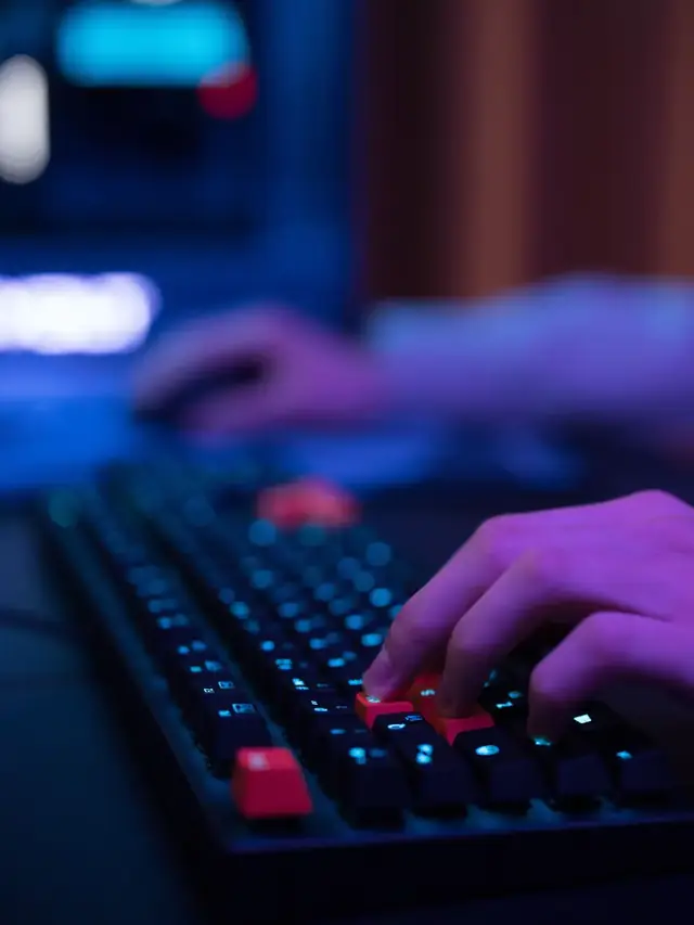 A hand pressing keys on a generic black keyboard at a desk; stock illustration of a key-registration check